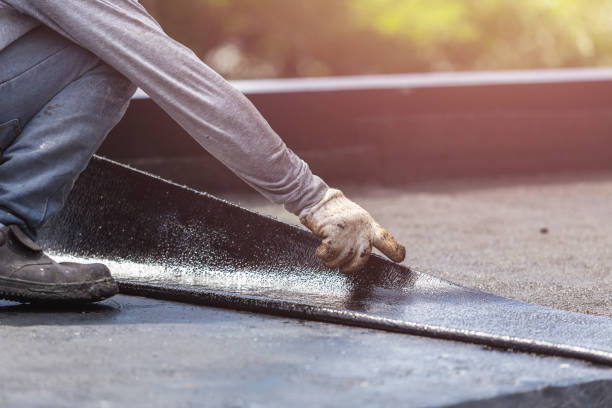 Professional Basement Waterproofing technician working in Haydenville, OH